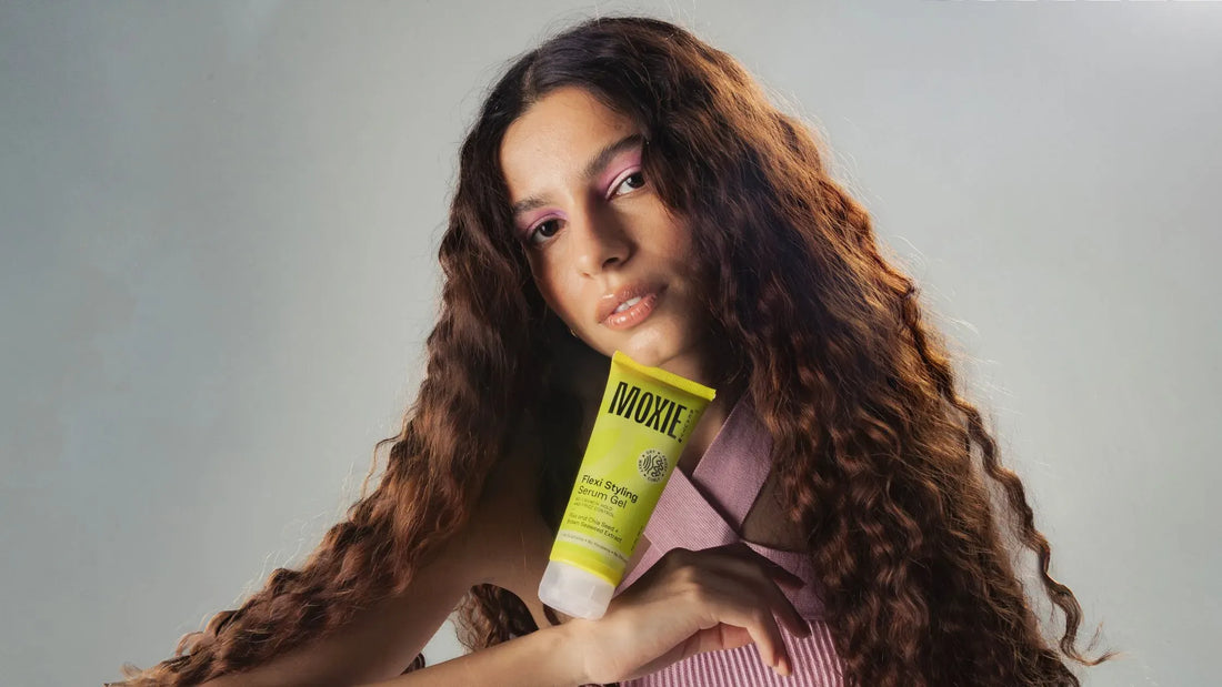 A person using a scalp massager to promote hair growth and improve scalp health.