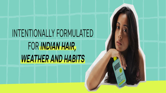 A woman showcasing elegant Indian hairstyles for long hair, featuring braids and traditional accessories.